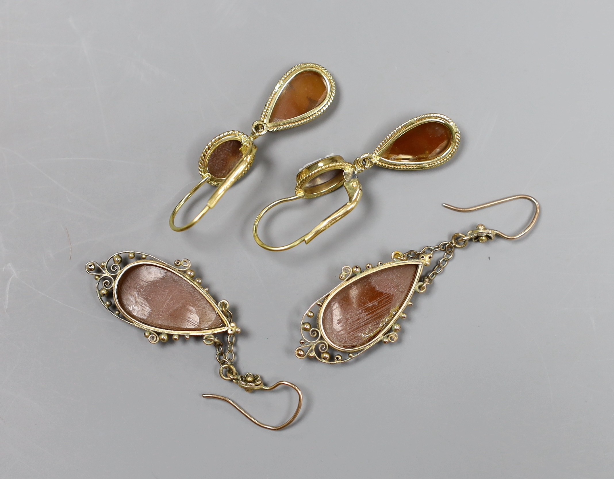 A pair of 18ct gold cameo drop earrings, 3cm and a pair of 9ct gold chain drop cameo earrings, 4.5cm